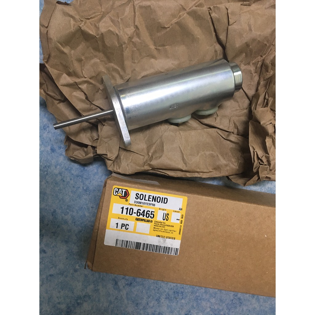 110-6465 Solenoid - solenoid beside its parts carton on packing paper