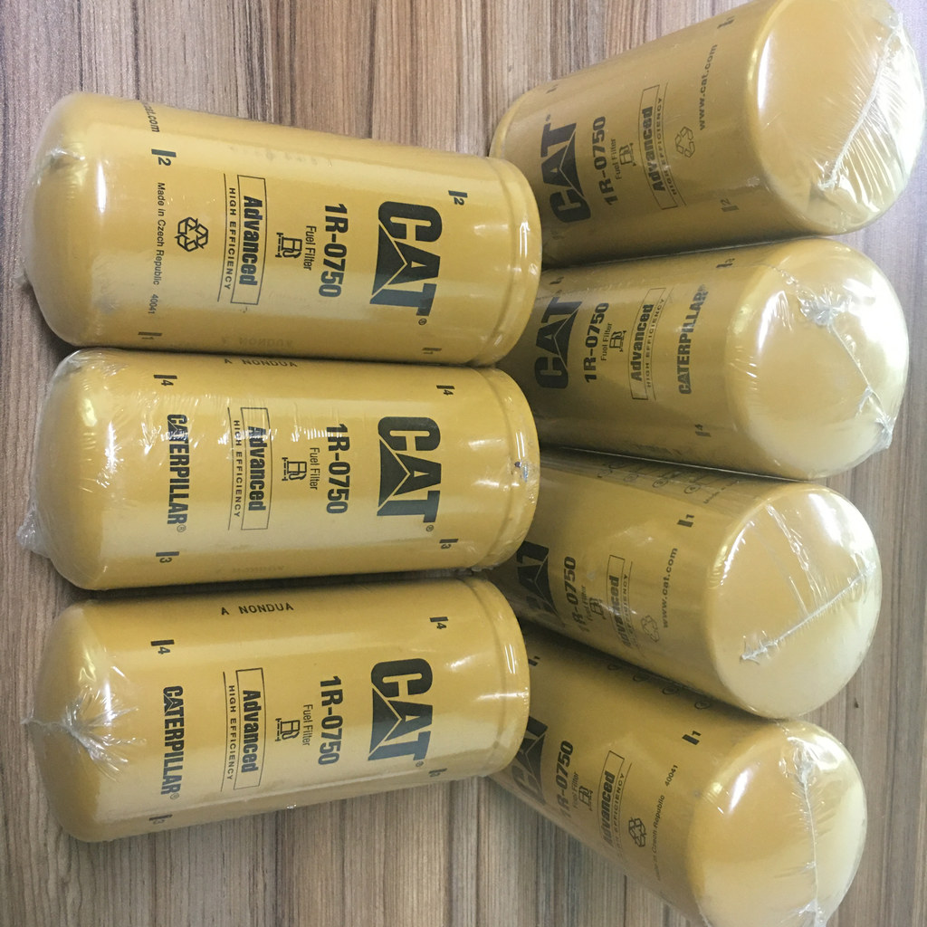 1R0750 Fuel Filter Assembly - six wrapped fuel filters laid out together