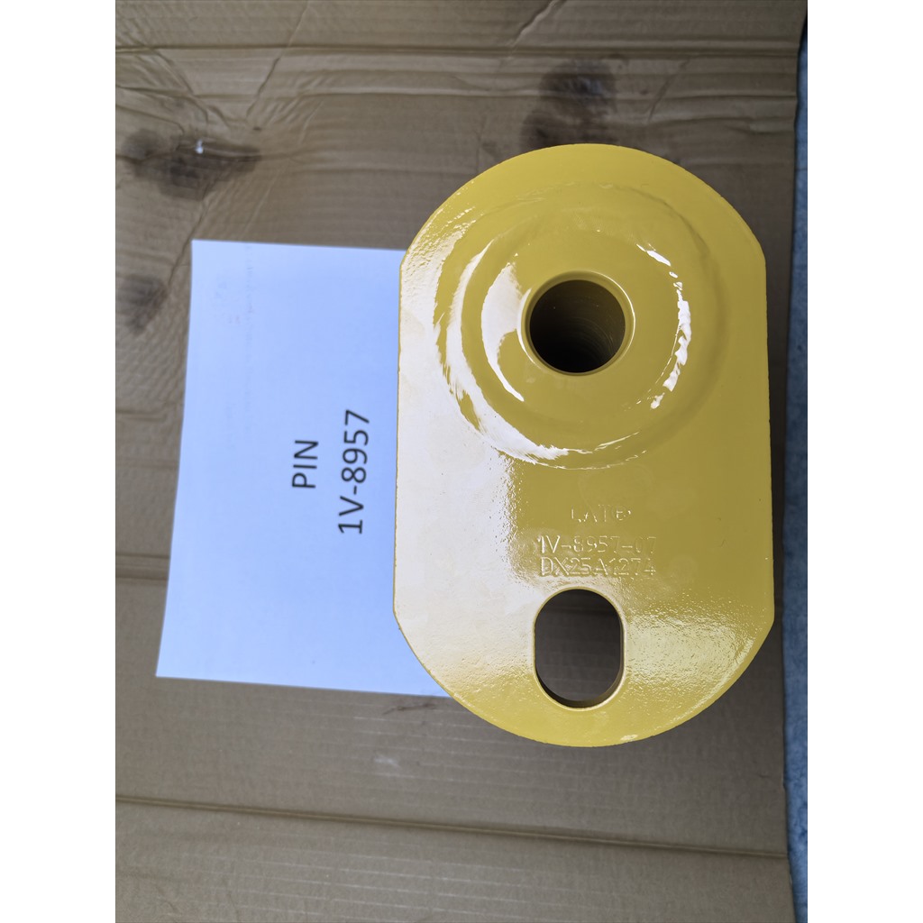 1V-8957 Pin - yellow mounting plate beside an identification sheet