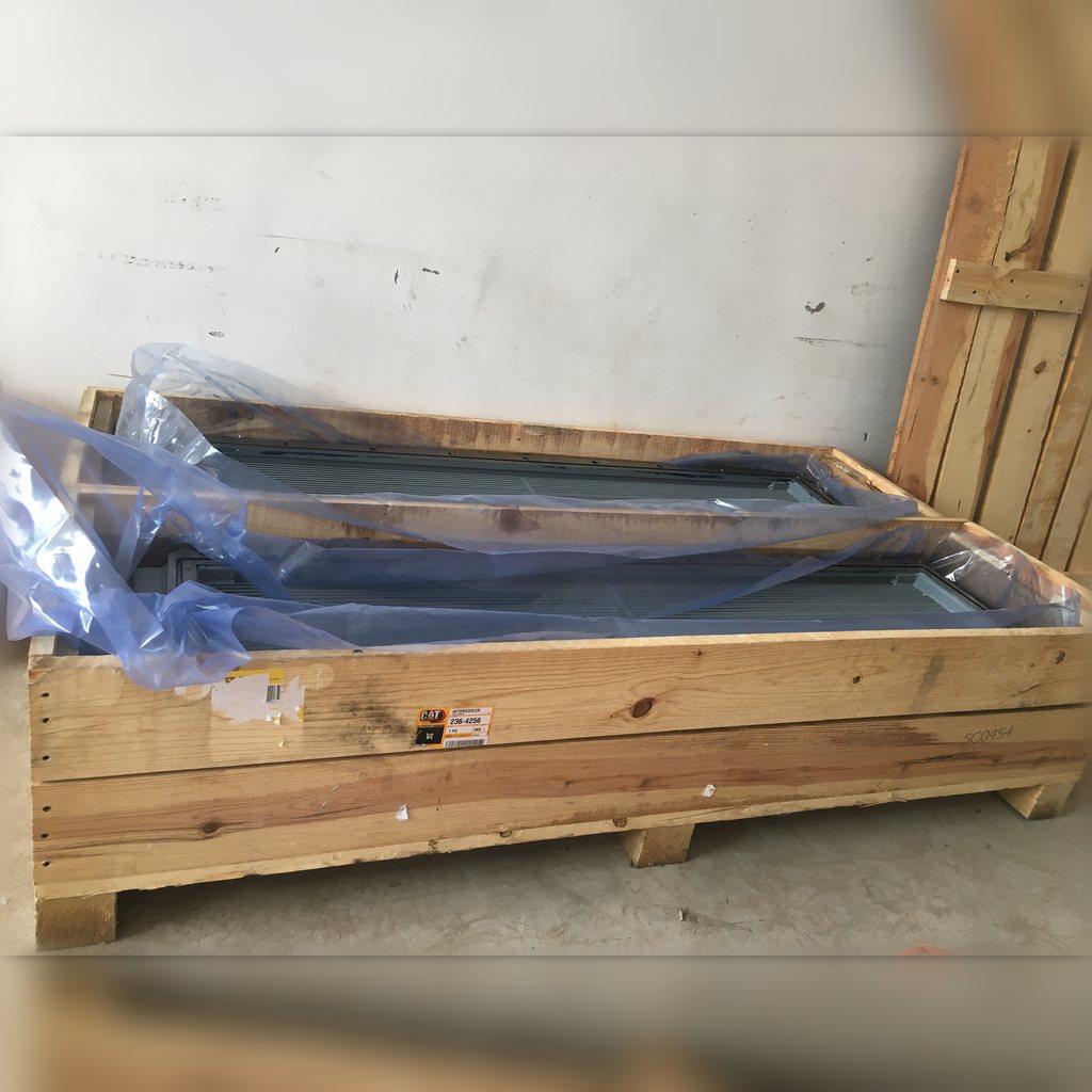 2364256 Aftercooler Core Assembly - angled view of the core inside its crate