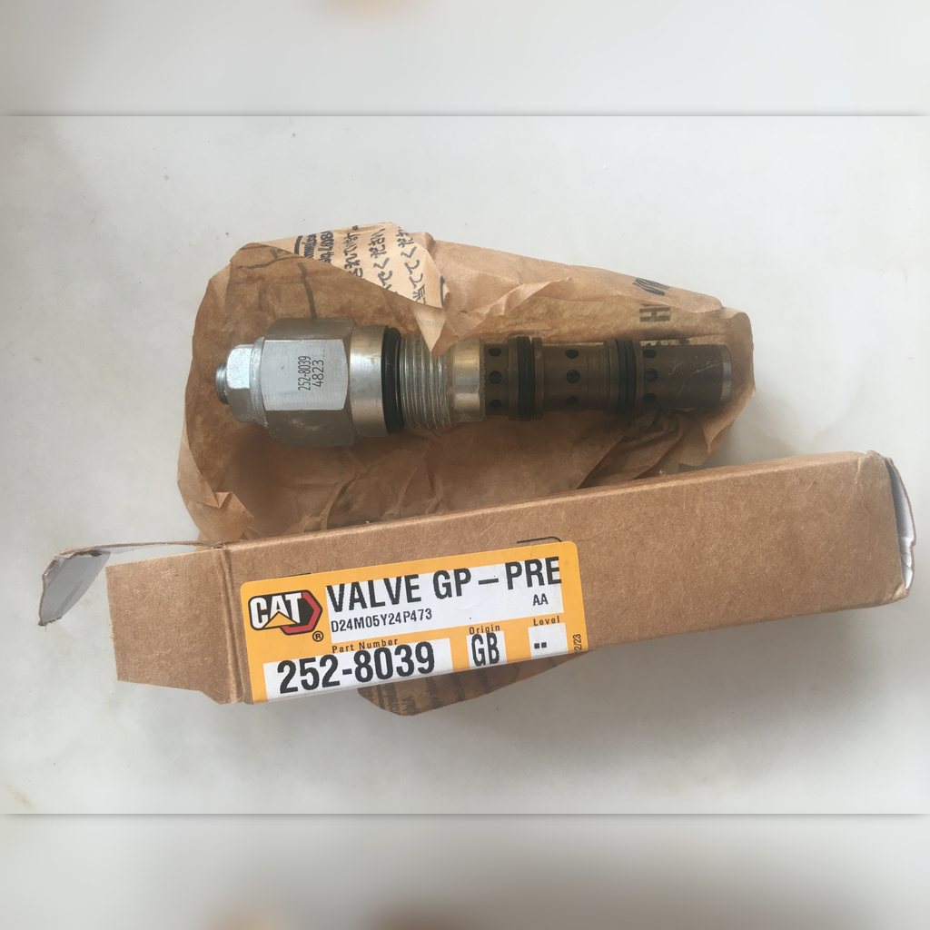 2528038 Valve group - valve and open carton laid out together