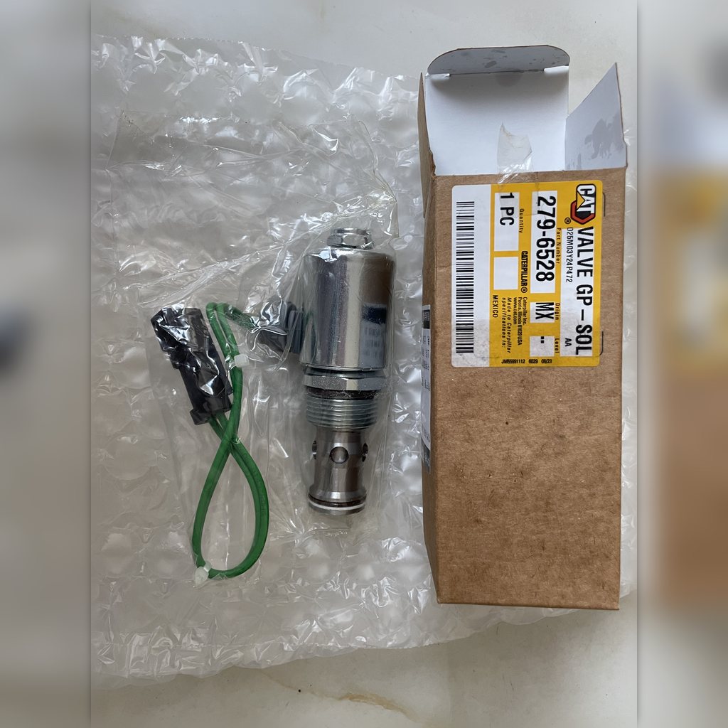 2796528 Valve group - valve and green lead beside labeled packaging