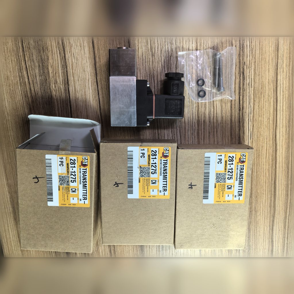 2811275 Transmitter - transmitter beside three labeled cartons