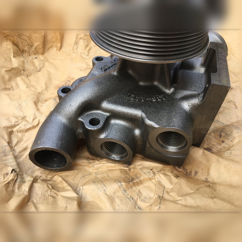 3522138 Water Pump Assembly - close-up of the housing and grooved pulley