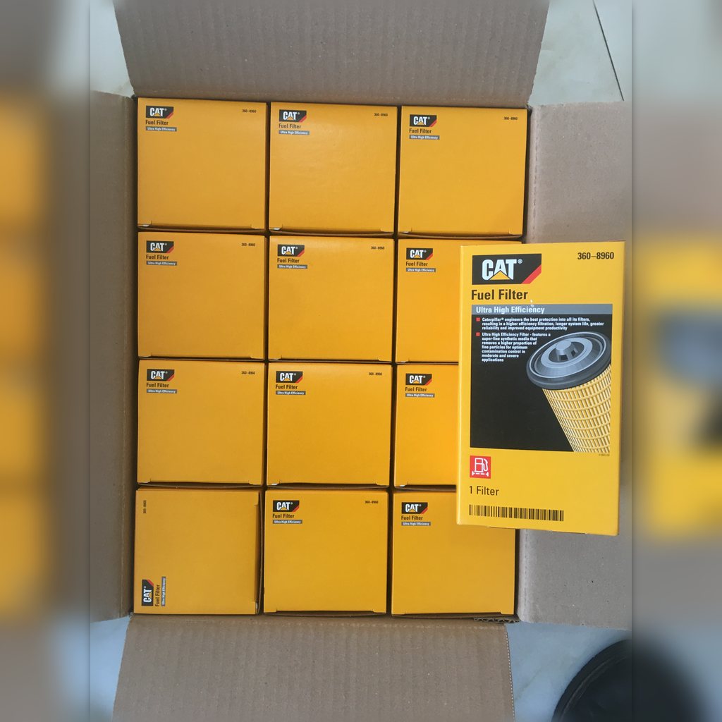 3608960 Fuel Filter Element - multiple yellow parts cartons laid out together
