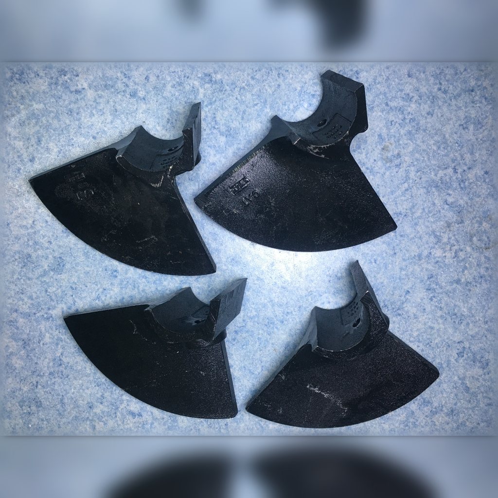 4196691 Auger Segment - several curved auger segments laid out together