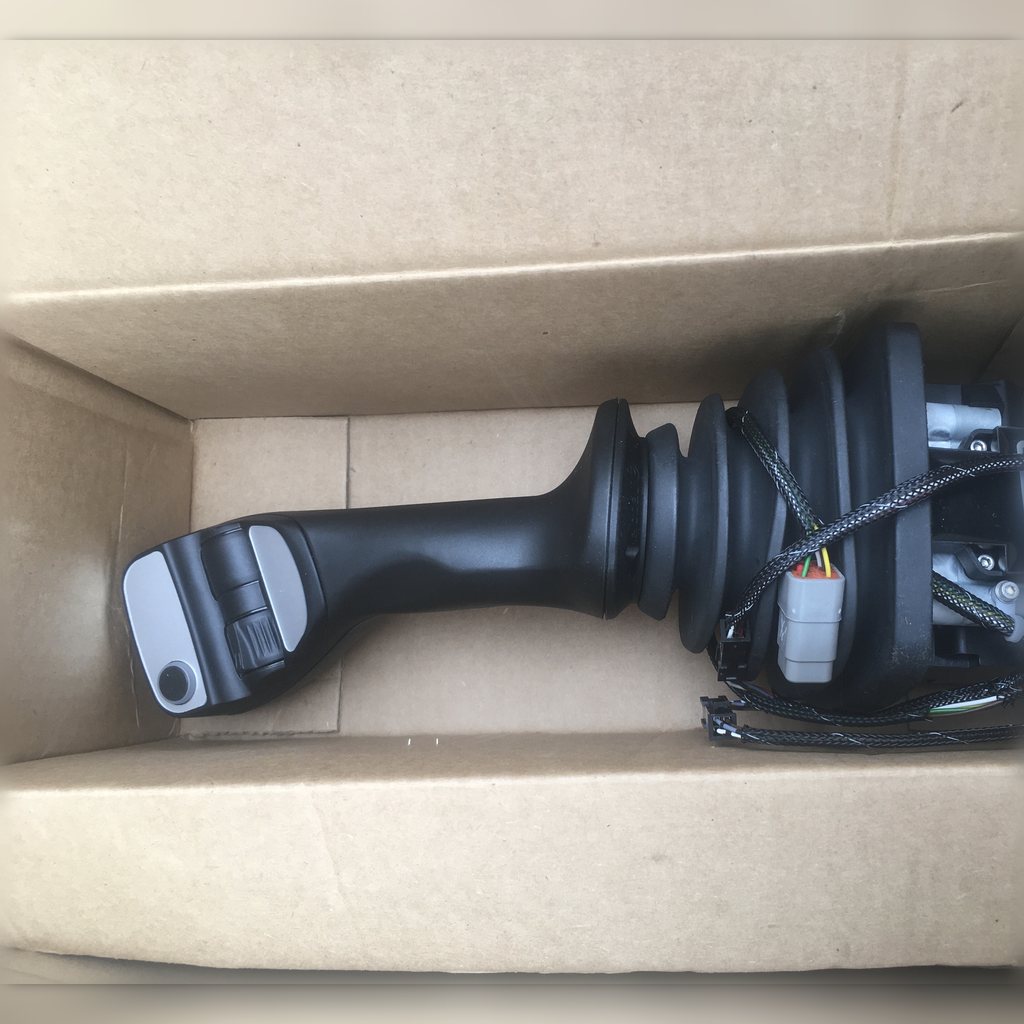 5429927 Joystick Control Group - joystick handle inside an open carton