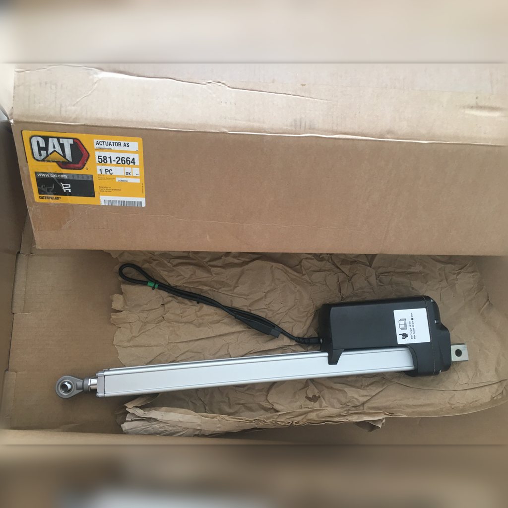 5812664 Actuator assembly - actuator laid across a labeled carton
