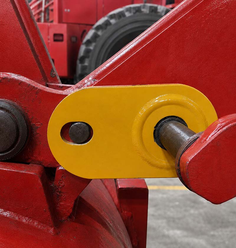 Yellow pin mounting plate installed on red equipment
